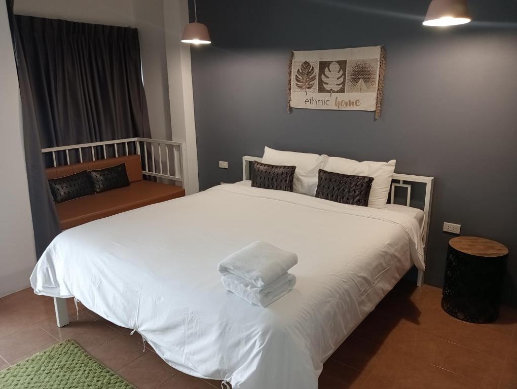 Postel nebo postele na pokoji v ubytování Pinpoint Hotel Phuket