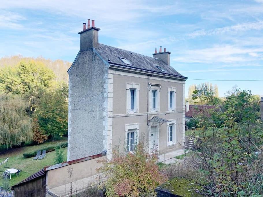 an old house with a chimney on top of it at Country House - Garden - Private access to the Loir in La Chartre-sur-le-Loir