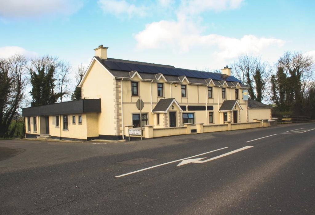 a large white house on the side of a road at The Coach Inn in Strabane