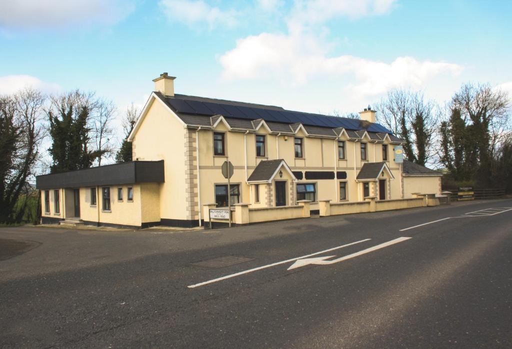 a large white house on the side of a road at The Coach Inn in Strabane