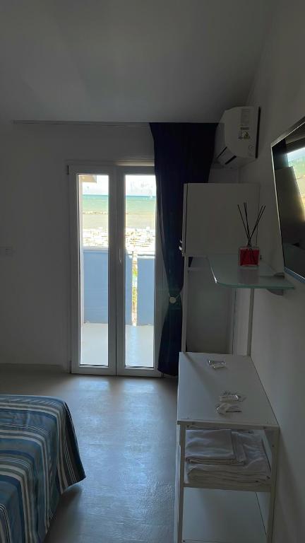 Postel nebo postele na pokoji v ubytování Hotel Rosa