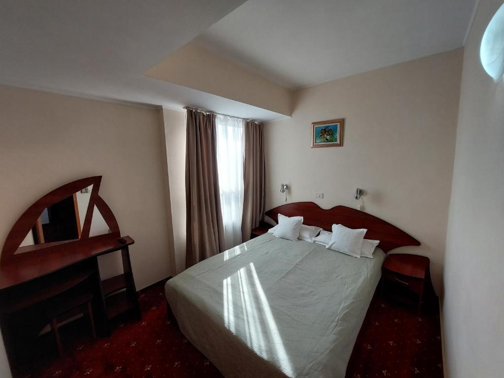 Postel nebo postele na pokoji v ubytování Hotel Egreta