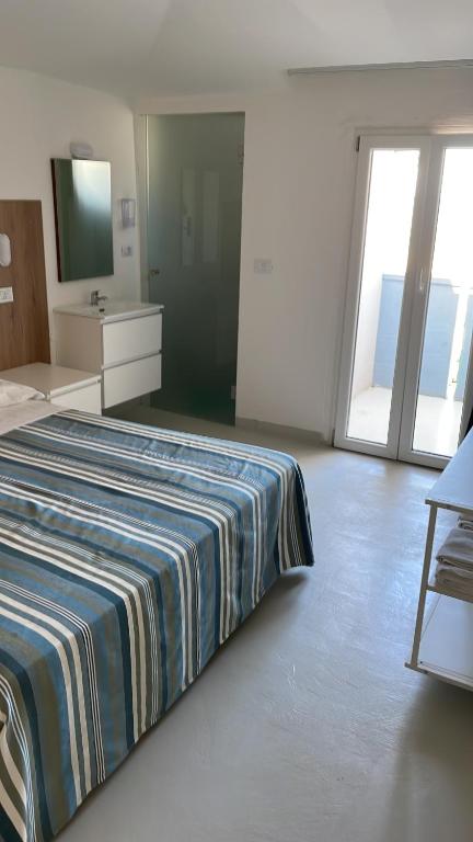 Postel nebo postele na pokoji v ubytování Hotel Rosa