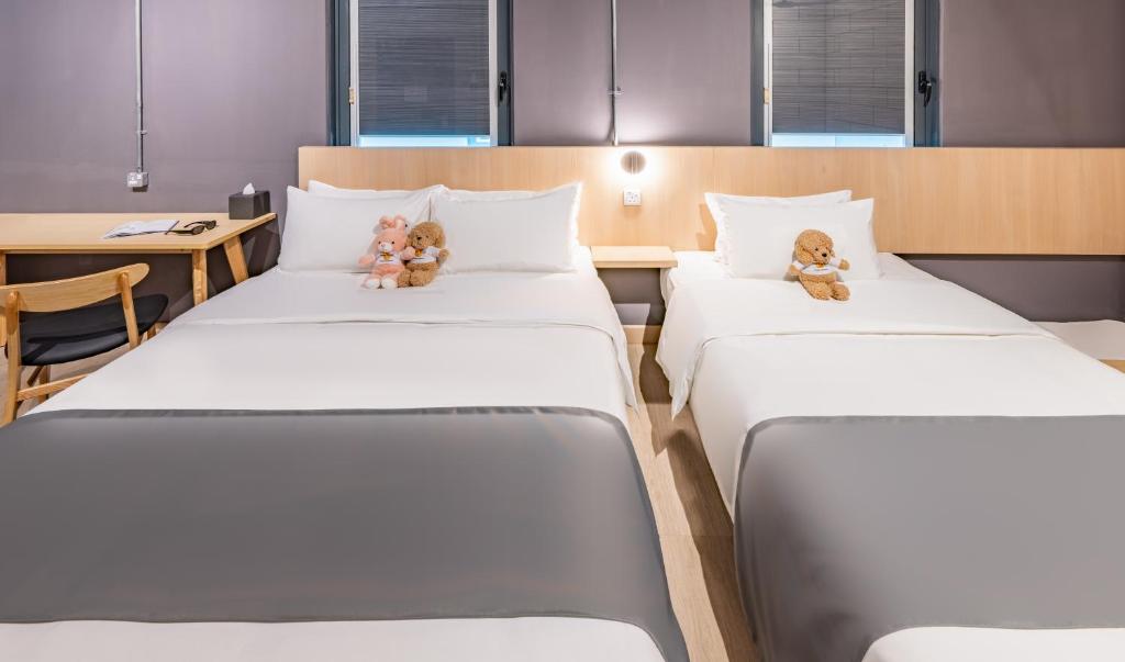 Postel nebo postele na pokoji v ubytování BRIX KLIA By Pinetree