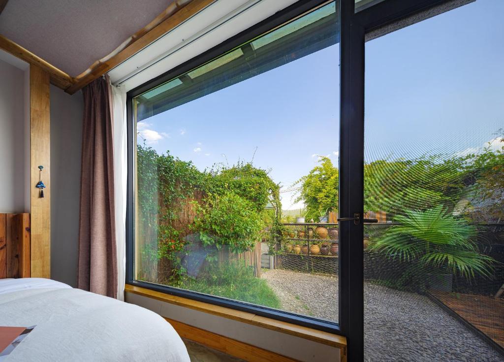 Postel nebo postele na pokoji v ubytování Wang Yun Residence Boutique Homestay Zhangjiajie