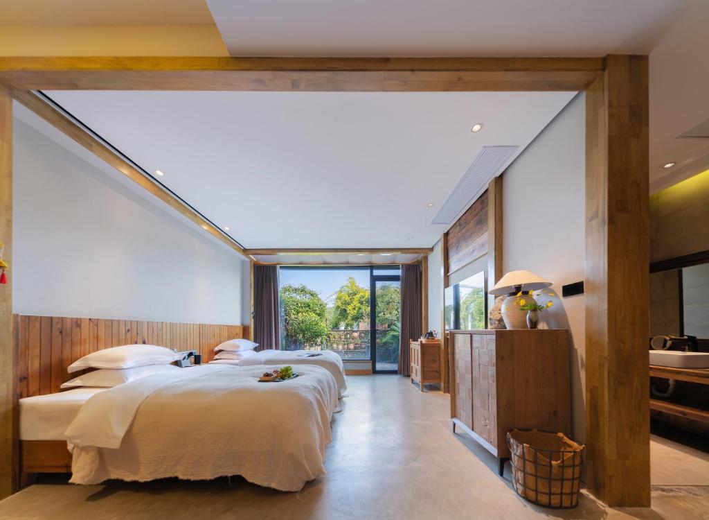 Postel nebo postele na pokoji v ubytování Wang Yun Residence Boutique Homestay Zhangjiajie