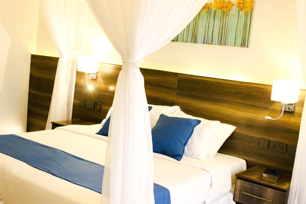 Postel nebo postele na pokoji v ubytování Lukenya Alkebu Resort