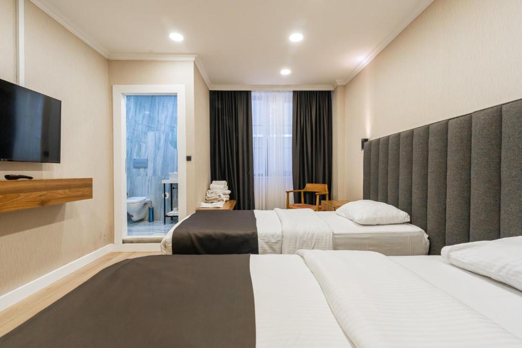 Postel nebo postele na pokoji v ubytování EÖB TAKSİM HOTEL