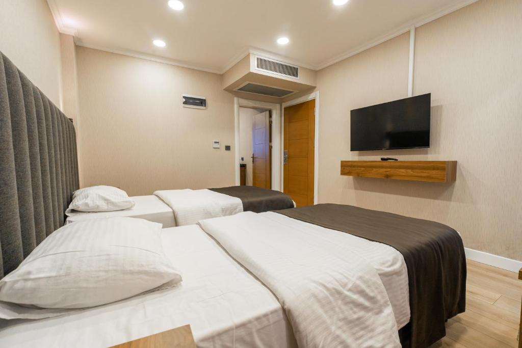 Postel nebo postele na pokoji v ubytování EÖB TAKSİM HOTEL