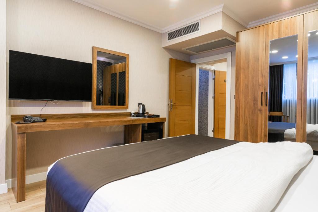 Postel nebo postele na pokoji v ubytování EÖB TAKSİM HOTEL
