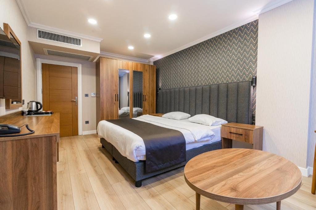 Postel nebo postele na pokoji v ubytování EÖB TAKSİM HOTEL