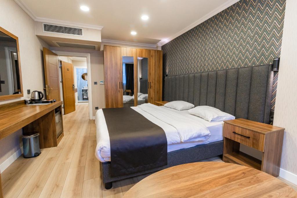 Postel nebo postele na pokoji v ubytování EÖB TAKSİM HOTEL