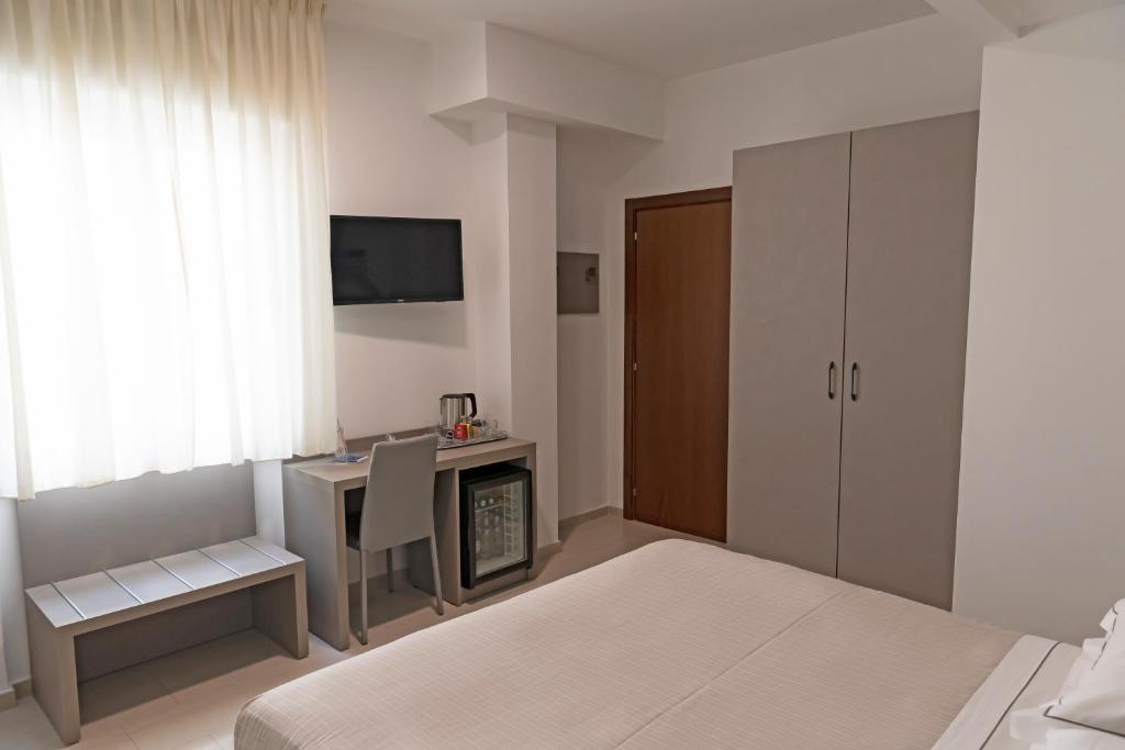 Postel nebo postele na pokoji v ubytování Hotel Miramare