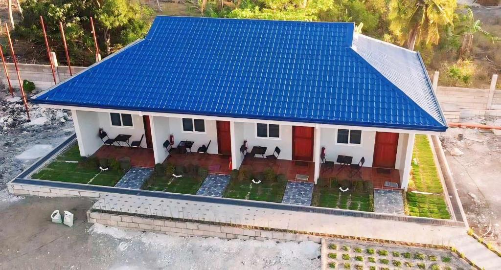 a model of a house with a blue roof at J & L Apartelle in Moalboal