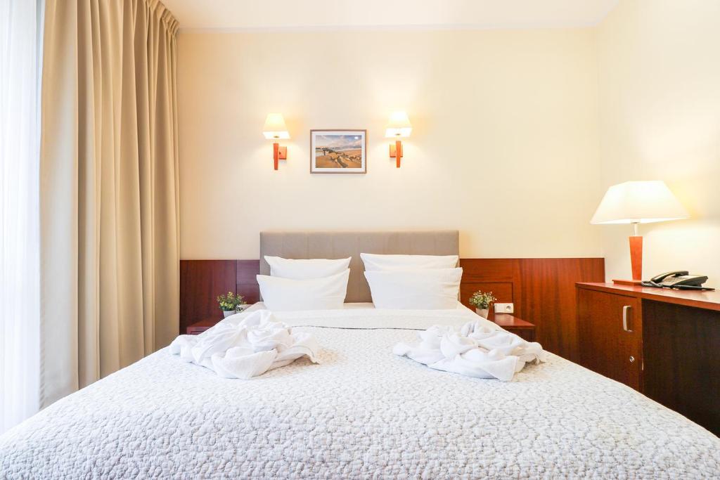 Postel nebo postele na pokoji v ubytování Atol Spa