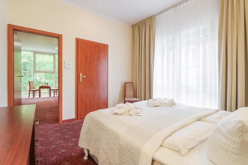 Postel nebo postele na pokoji v ubytování Atol Spa