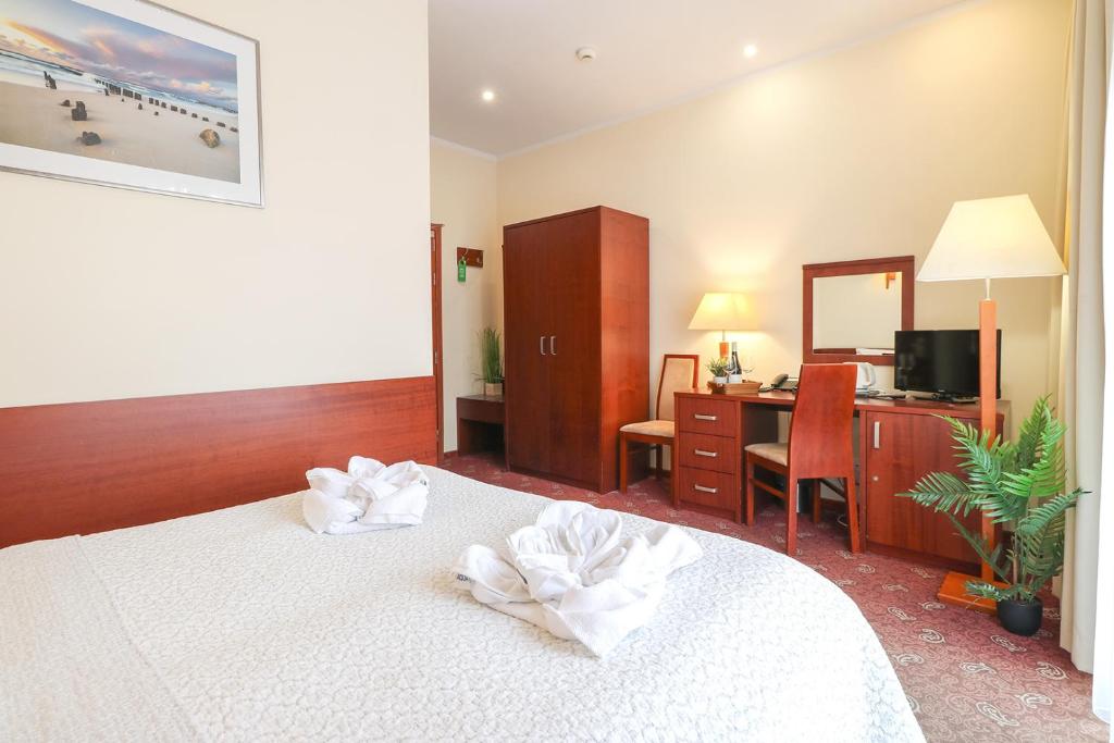 Postel nebo postele na pokoji v ubytování Atol Spa