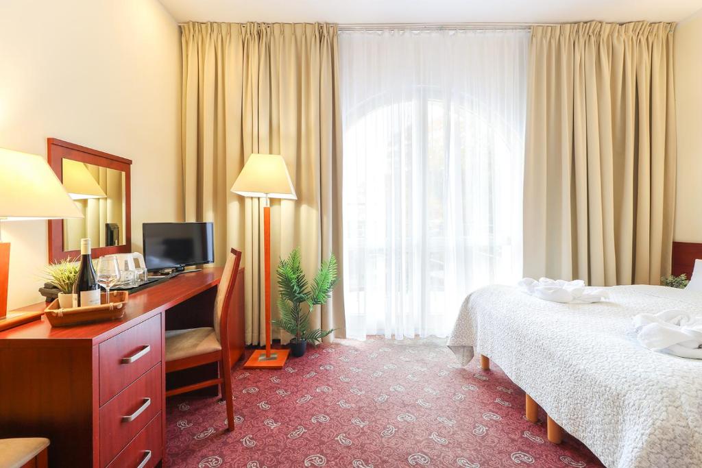 Postel nebo postele na pokoji v ubytování Atol Spa