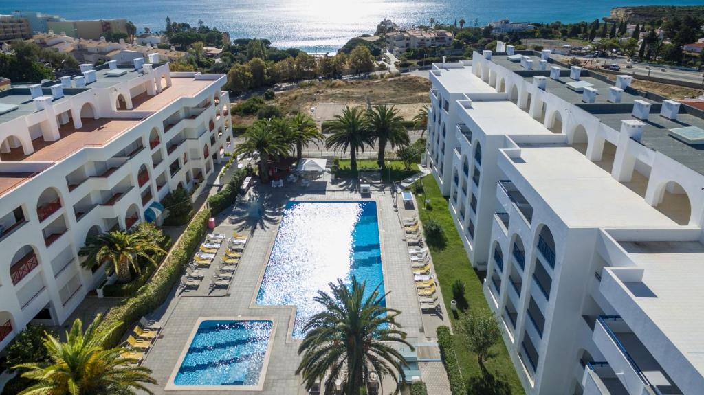 an aerial view of a building with a swimming pool at Ukino Terrace Algarve Concept in Armação de Pêra