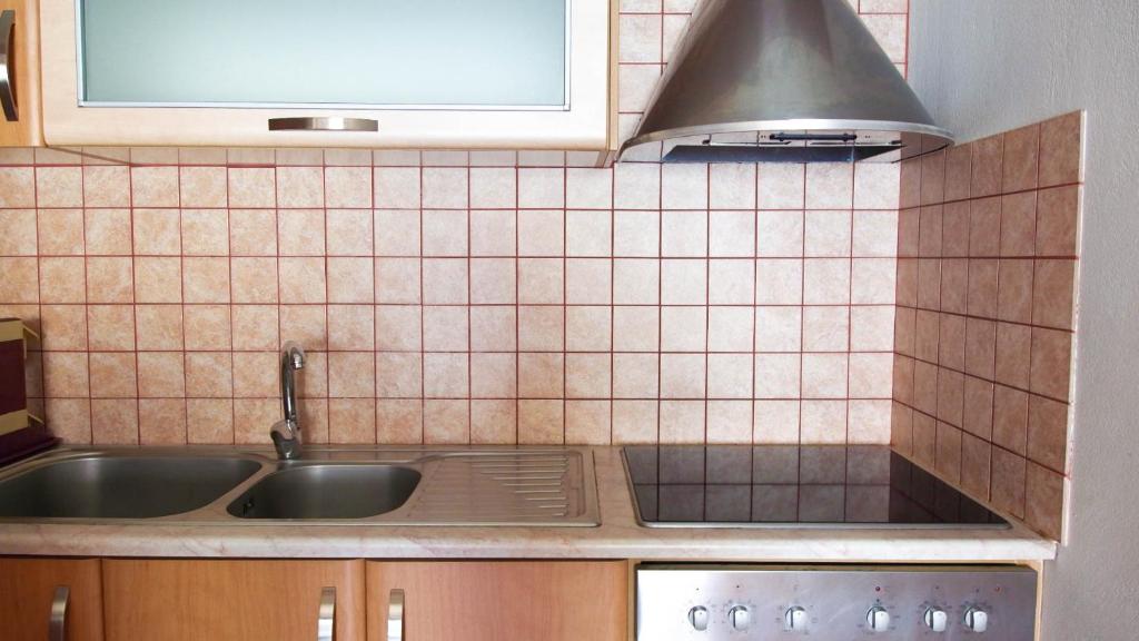 Kuchyň nebo kuchyňský kout v ubytování Guest House Suga 1