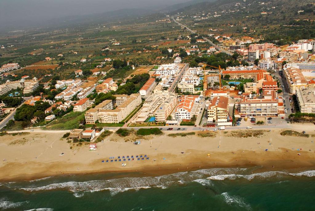 an aerial view of a beach with hotels and buildings at Cala Montero - Inalko in Alcossebre