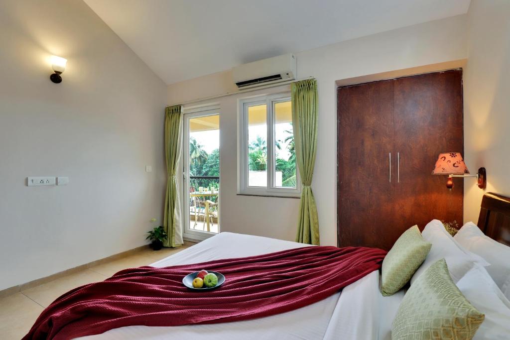 Postel nebo postele na pokoji v ubytování Veera Strand Park Serviced Apartments near Calangute