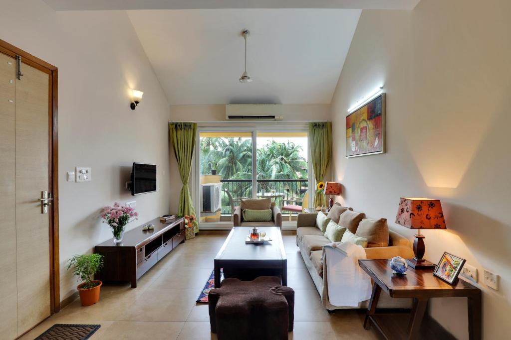 TV a/nebo společenská místnost v ubytování Veera Strand Park Serviced Apartments near Calangute