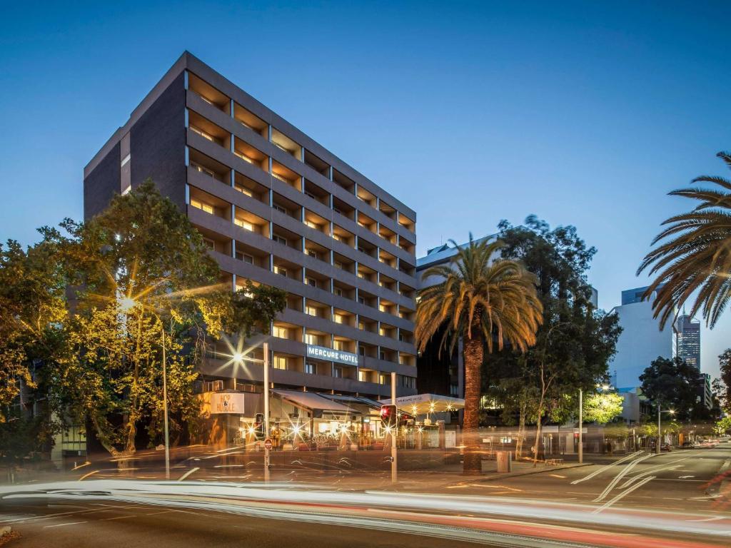 a building at night with a street in front at Mercure Perth On Hay in Perth