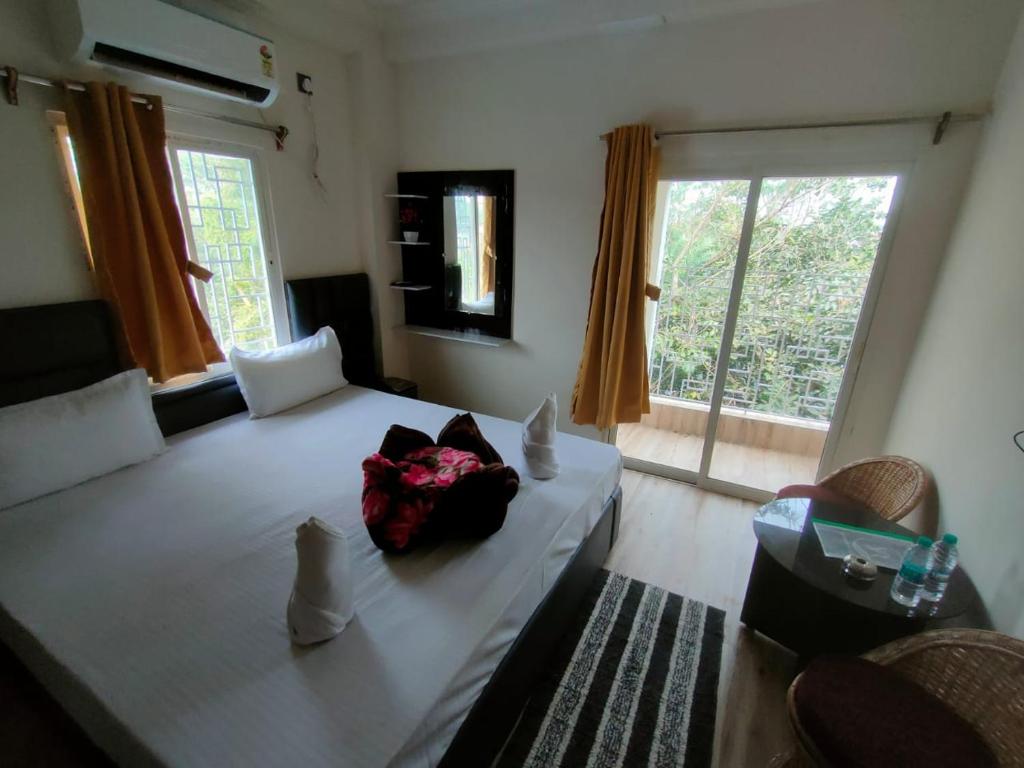 מיטה או מיטות בחדר ב-Hotel Version Regency