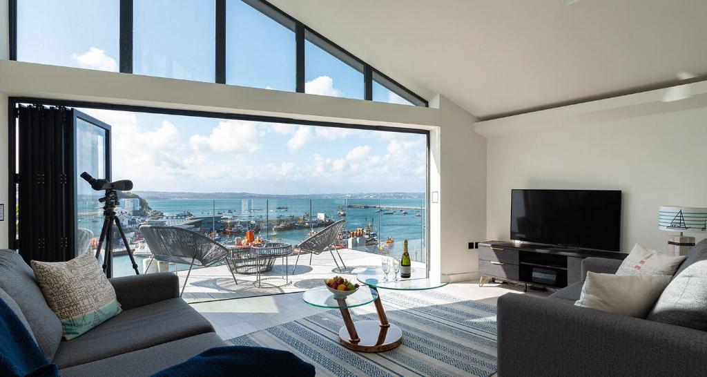 a living room with a large window with a view at High Seas - NEW LISTING in Brixham