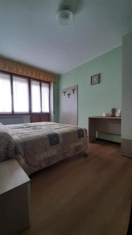 Postel nebo postele na pokoji v ubytování Albergo Bar Ristorante Da Gina