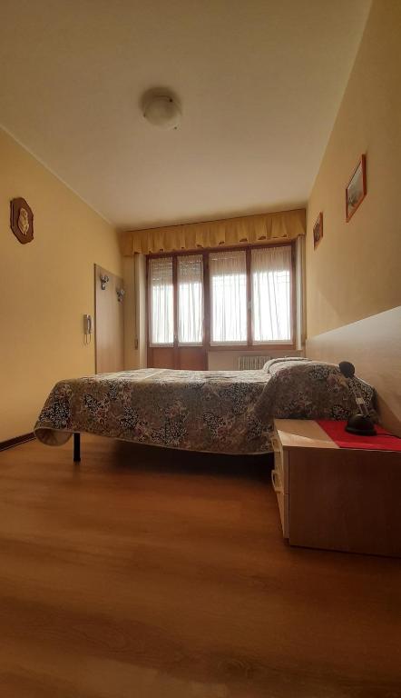 Postel nebo postele na pokoji v ubytování Albergo Bar Ristorante Da Gina