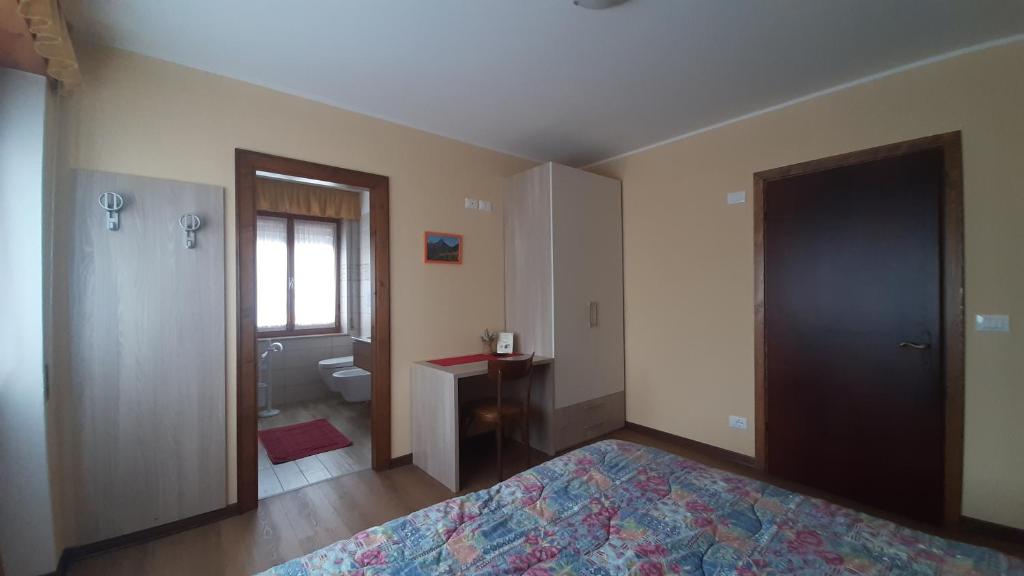 Postel nebo postele na pokoji v ubytování Albergo Bar Ristorante Da Gina