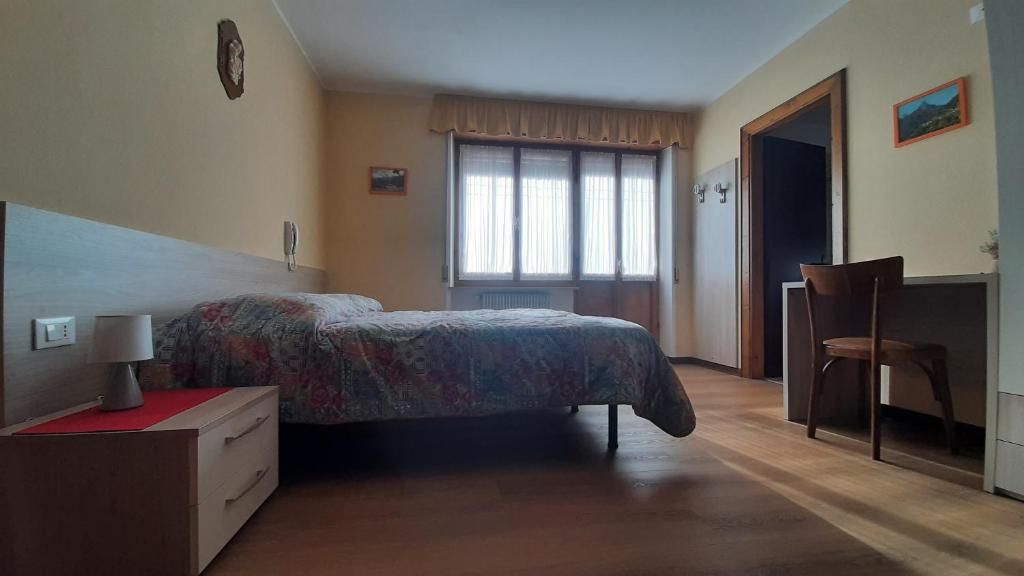 Postel nebo postele na pokoji v ubytování Albergo Bar Ristorante Da Gina