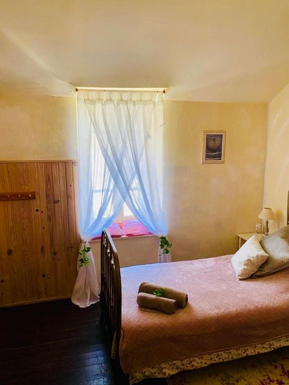 Postel nebo postele na pokoji v ubytování Les Contes