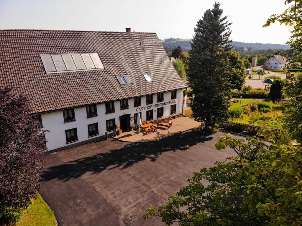 an aerial view of a house with a solar roof at Gasthaus Krone Holzschlag in Bonndorf im Schwarzwald