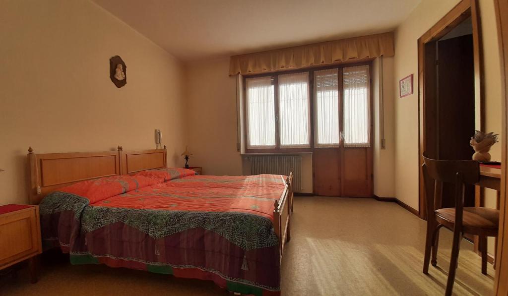 Postel nebo postele na pokoji v ubytování Albergo Bar Ristorante Da Gina