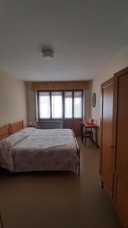 Postel nebo postele na pokoji v ubytování Albergo Bar Ristorante Da Gina
