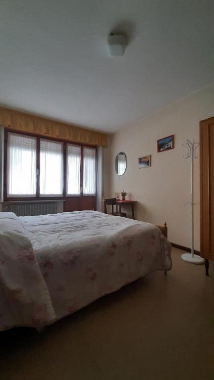 Postel nebo postele na pokoji v ubytování Albergo Bar Ristorante Da Gina