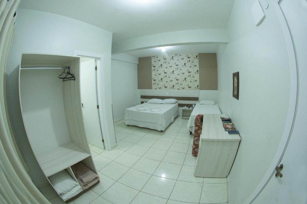 Postel nebo postele na pokoji v ubytování Hotel Sambakia