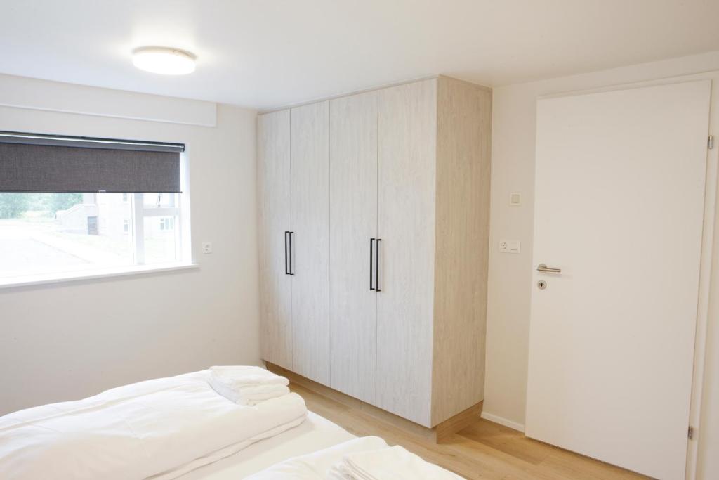 Voodi või voodid majutusasutuse Eiðar - Apartments toas