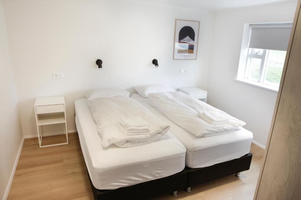 Voodi või voodid majutusasutuse Eiðar - Apartments toas