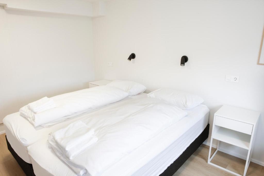 Voodi või voodid majutusasutuse Eiðar - Apartments toas
