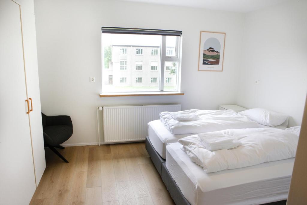 Voodi või voodid majutusasutuse Eiðar - Apartments toas