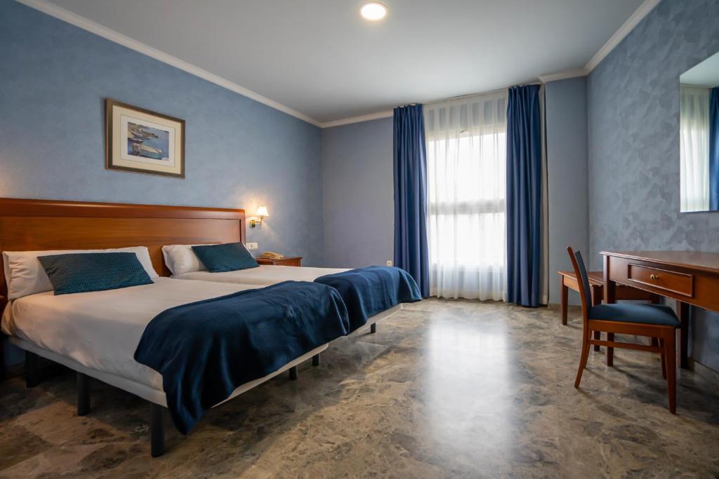 Katil atau katil-katil dalam bilik di Hotel Bartos