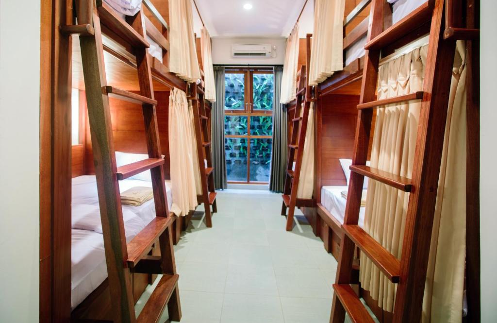 Postel nebo postele na pokoji v ubytování Pudak Sari Unizou Hostel