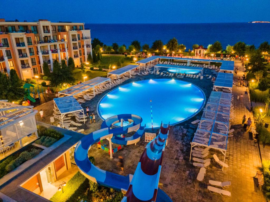 an overhead view of a swimming pool at night at Premier Fort Sands Resort - Full Board in Sunny Beach