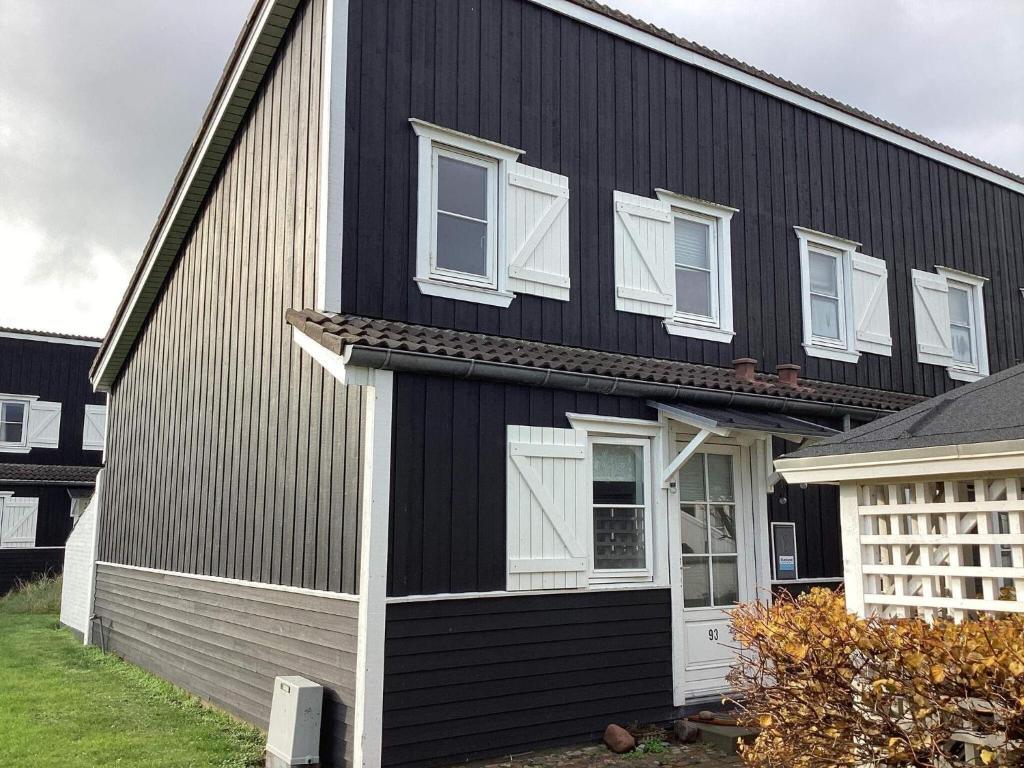 a black house with white windows at 6 person holiday home in Vestervig-By Traum in Vestervig