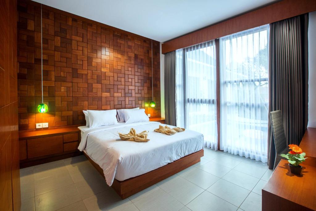 Postel nebo postele na pokoji v ubytování Pudak Sari Unizou Hostel