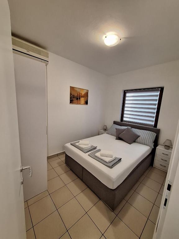 Postel nebo postele na pokoji v ubytování DIN2 Ljubic